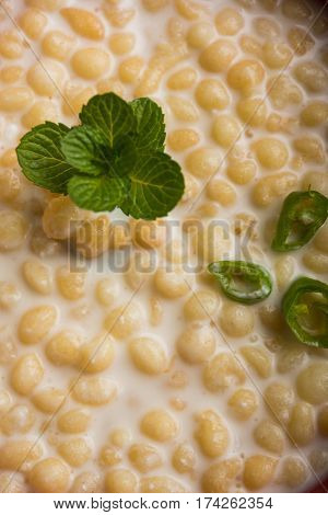 Dahi Bundi or Boondi Raita, favourite indian started or side dish made using Rajasthani snack food made from sweetened, fried chickpea flour, called Boondi with sweet and salty curd or buttermilk