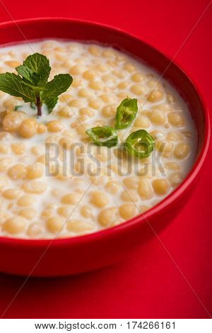 Dahi Bundi or Boondi Raita, favourite indian started or side dish made using Rajasthani snack food made from sweetened, fried chickpea flour, called Boondi with sweet and salty curd or buttermilk