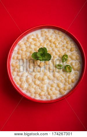 Dahi Bundi or Boondi Raita, favourite indian started or side dish made using Rajasthani snack food made from sweetened, fried chickpea flour, called Boondi with sweet and salty curd or buttermilk