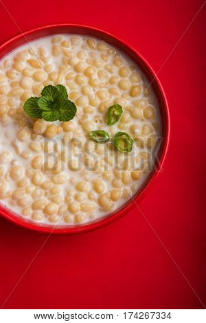 Dahi Bundi or Boondi Raita, favourite indian started or side dish made using Rajasthani snack food made from sweetened, fried chickpea flour, called Boondi with sweet and salty curd or buttermilk