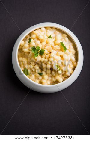 Dahi Bundi or Boondi Raita, favourite indian started or side dish made using Rajasthani snack food made from sweetened, fried chickpea flour, called Boondi with sweet and salty curd or buttermilk