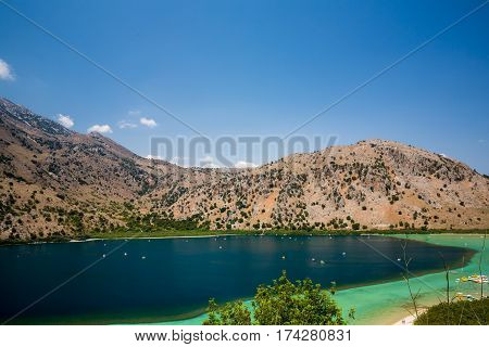 Beach in village Kavros in Crete island Greece. Magical turquoise waters lagoons. Travel Background