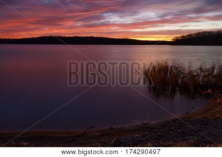 Shoreline image of a predawn sunrise at Lake Jacomo located in the Kansas City Missouri metro are.