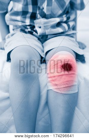 Child Injured. Wound On Child's Knee With Bandage. Human Health Care And Medicine Concept.