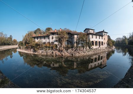 Country house along the Naviglio Grande of Turbigo (Milan Lombardy Italy) at fall. Fisheye
