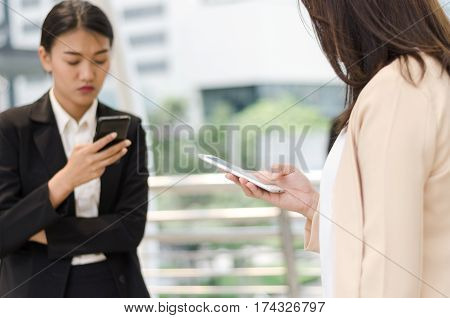 Digital lifesyle concept. Close-up young businesswomen's using smart phone.