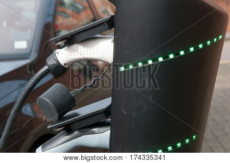 electric car charging to refuel at the charge station