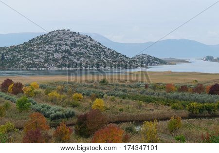 View onto the river and hills near Ploce, Croatia in foggy misty autumnal morning