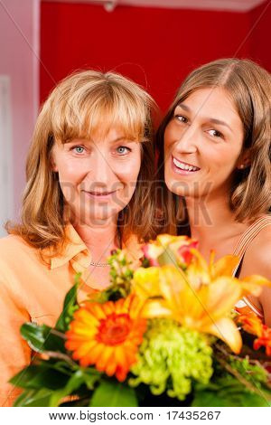 Mother and daughter ÃÂ¢Ã?Ã? the daughter has given her mother flowers