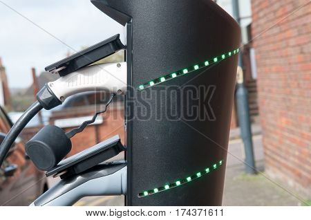 electric car charging to refuel at the charge station