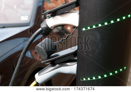 electric car charging to refuel at the charge station
