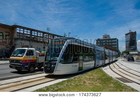 Rio de Janeiro, Brazil - February 10, 2017: VLT tram is passing in the street along with cars in traffic.