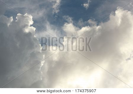 This is a view of the sky in San Jose after a rain storm with fluffy clouds that appear to have an outline