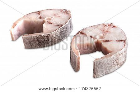Two steaks of cobia on a white background