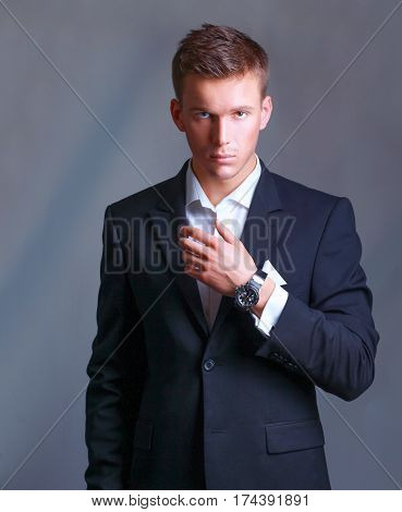 Portrait of a young executive in business suit.