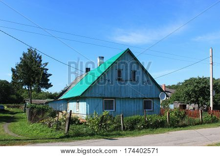 Old former german wooden building in the Morskoe (Pillkoppen) village in the Curonian Spit National Park. Russia.