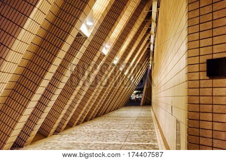 Arched Tunnel Contiguous To A Wall Of The Building Of Hong Kong Cultural Centre At Evening