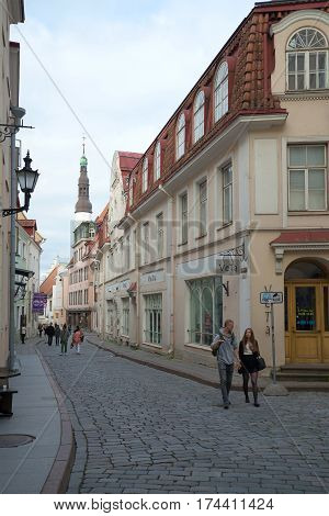 TALLINN, ESTONIA - JULY 31, 2015: Evening walk around the old town. A view of the street Pikk