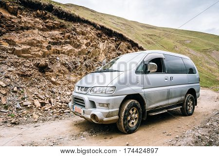Truso Gorge, Georgia - May 21, 2016: Mitsubishi Delica Space Gear on country road in summer mountains landscape. Delica is a range of trucks and multi-purpose vehicles produced by Mitsubishi Motors.