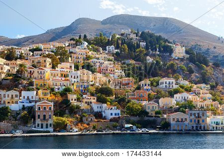 Greece. Dodecanesse. Island Symi Simi . Colorful houses on the rocks