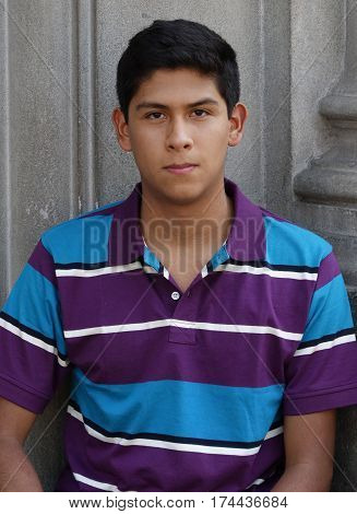 Serious Teen Hispanic Boy Wearing Purple Shirt