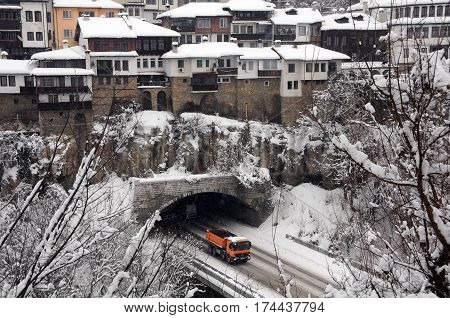 VELIKO TARNOVO BULGARIA - JANUARY 19 2017: Yellow truck comes out of the vehicular tunnel