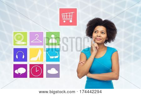 people, e-commerce and online shopping concept - happy afro american young woman over gray grid background with menu icons
