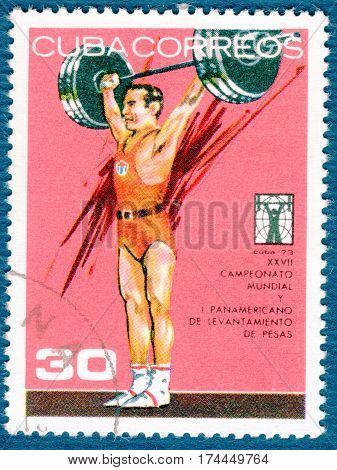 CUBA - CIRCA 1973: Postage stamp printed in Cuba  with a picture of a weightlifting, from the series 