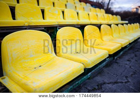 Old Yellow Seat In Stadium Closeup