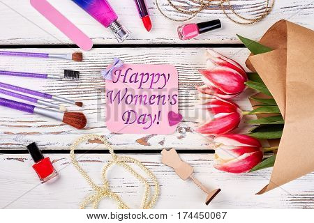 Accessories and flowers on wood. Romantic gift on Women's day.