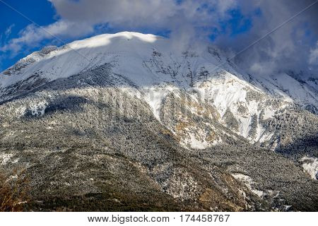 The mountain peak of Les Croix coverred in snow and frost in winter. Saint Andre d'Embrun Hautes-Alpes French Alps France