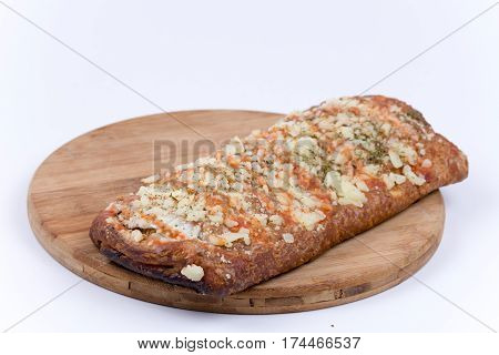 Pizza Sandwich On Wooden Board Over White