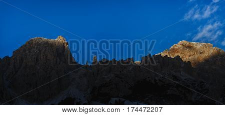 last rays of Sun on the top of Cir Group Dolomites