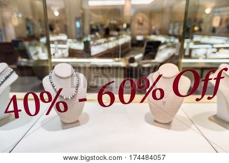 Jewelry store with 40 to 60 percent off discount sign on window display
