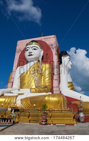 Four seated Buddhas in Kyaikpun Pagoda in Bago, Myanmar