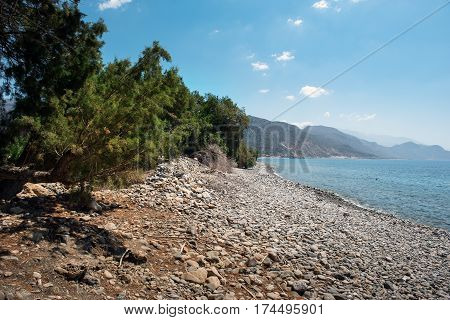Pebble beach with turquoise lagoon near Paleochora town on Crete island, Greece