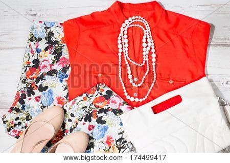Colorful set of female summer clothes in white and orange colors, romantic style