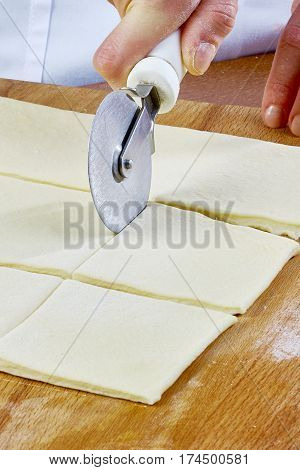 Making Croissant Cookies with Jam. Series. Cutting dough with cutter Handmade Series Food recipes Food being prepared and cooked in a contemporary kitchen, with and without the chef