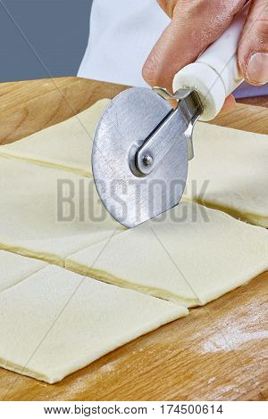 Making Croissant Cookies with Jam. Series. Cutting dough with cutter Handmade Series Food recipes Food being prepared and cooked in a contemporary kitchen, with and without the chef