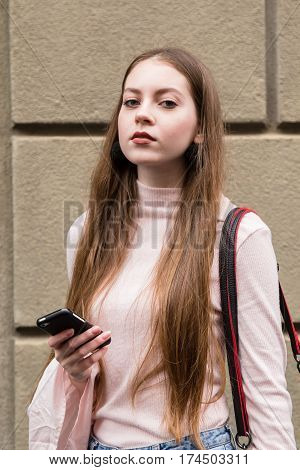 MILAN ITALY - FEBRUARY 23: Fashionable woman poses outside Les Copains fashion show during Milan Women's Fashion Week on FEBRUARY 23 2017 in Milan.