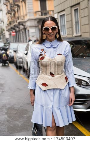 MILAN ITALY - FEBRUARY 23: Fashionable woman poses outside Les Copains fashion show during Milan Women's Fashion Week on FEBRUARY 23 2017 in Milan.