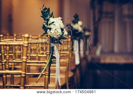 Floristic design on wedding ceremony day. Buch of flowers in wedding hall.