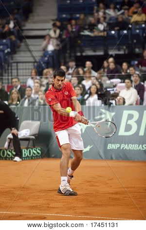 BELGRADE, SERBIA - MARCH 7: Novak Djokovic plays against John Isner in the Davis Cup 2010 on March 7, 2010 in Belgrade, Serbia.