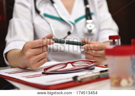 Woman Therapist Sitting In Clinic