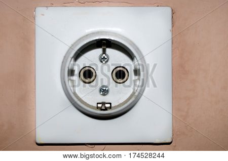 Three white European 220V power socket on green wall in Novi Sad, Serbia