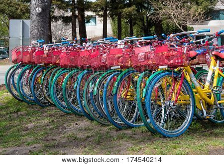 Mountain View CA USA - March 3 2017 - Google bicycles lined up ready for Google employees to use them for short rides between buildings on Google campus in Mountain View CA USA on March 3rd 2017.