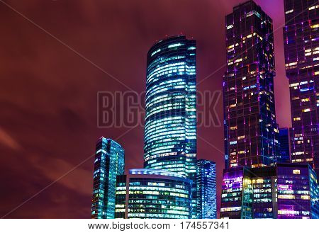 office building at night on the background of diffuse sky