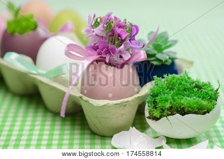 Clolorful easter eggs in tray on table