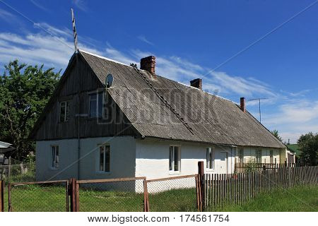 Old former german building (built in 1935) in the Morskoe (Pillkoppen) village in the Curonian Spit National Park. Russia.