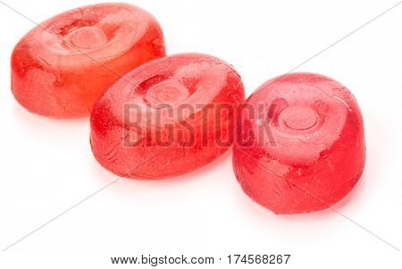 Three colorful fruit hard sugar candies,  boiled sweeties or sugar plums isolated on white background cutout